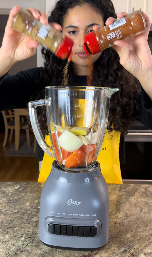 Adding spices to a blender