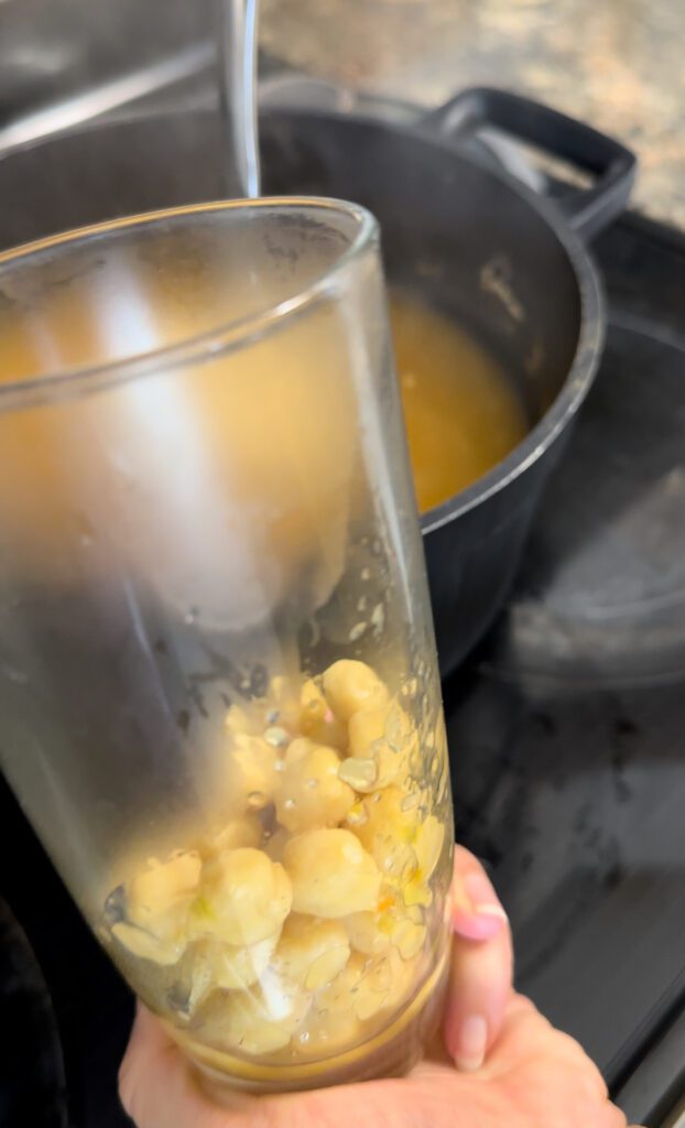 Adding chickpeas to a cup