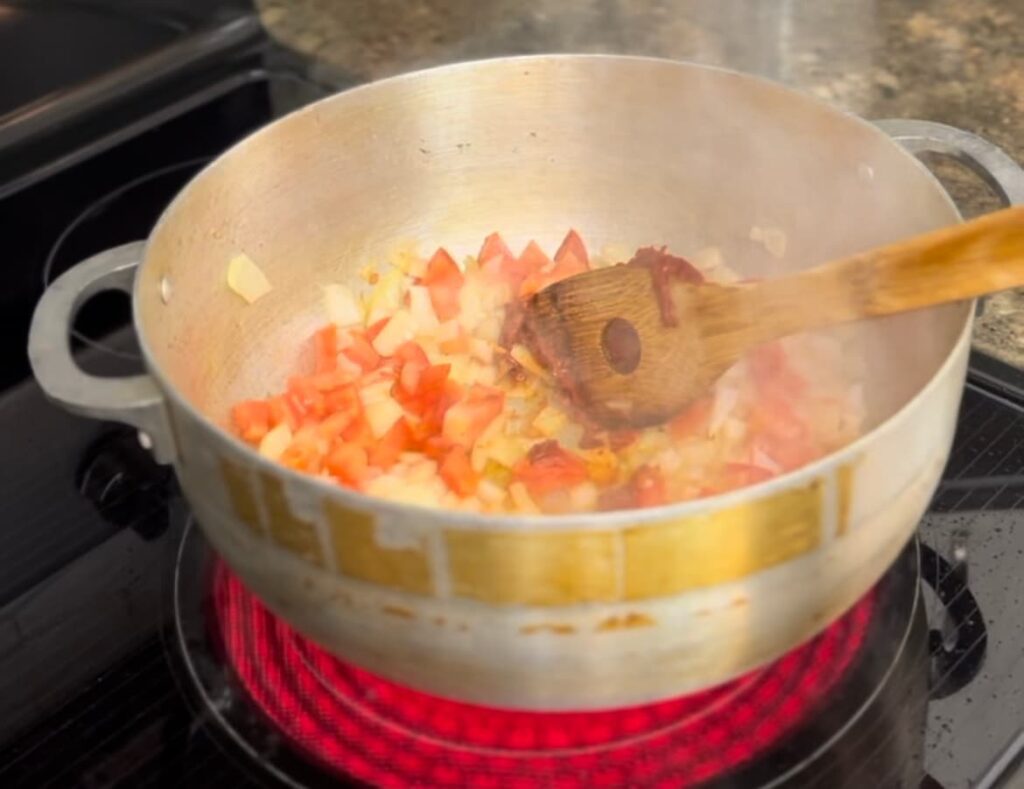 sautéing tomatoes and onions